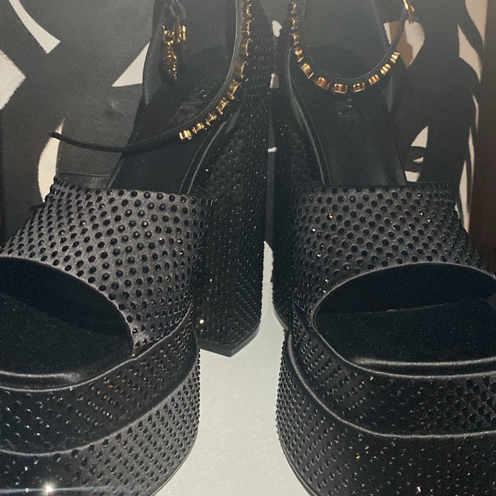 Size 41 Versace Platforms; Never worn.